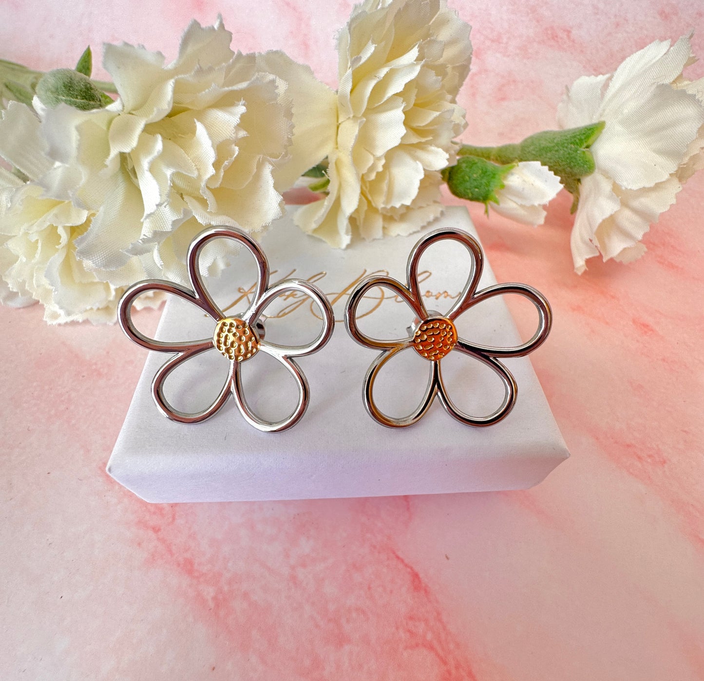 Oversized Hollow Flower silver stud earrings.