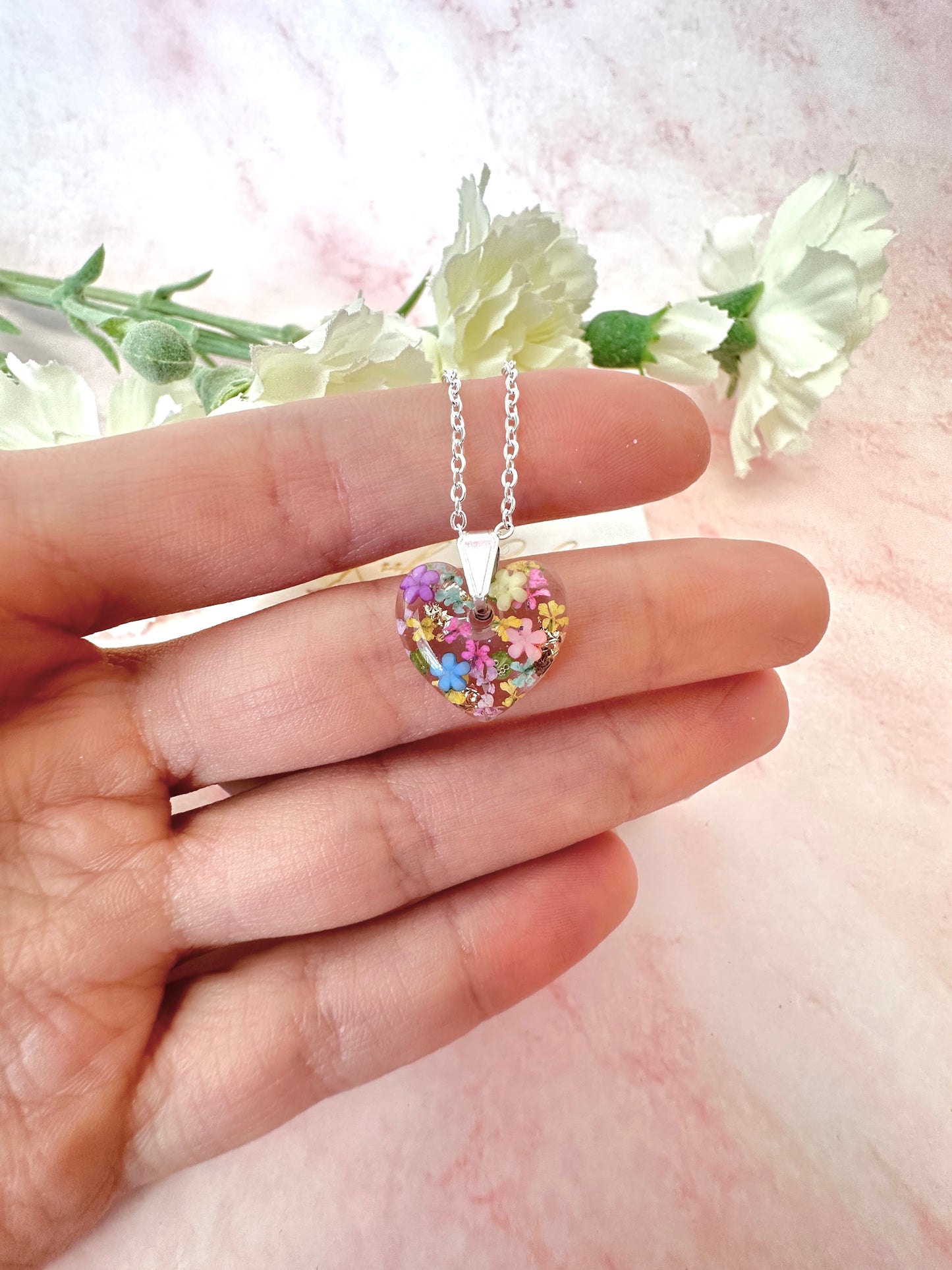 Silver Rainbow Burst bloom Heart necklace.