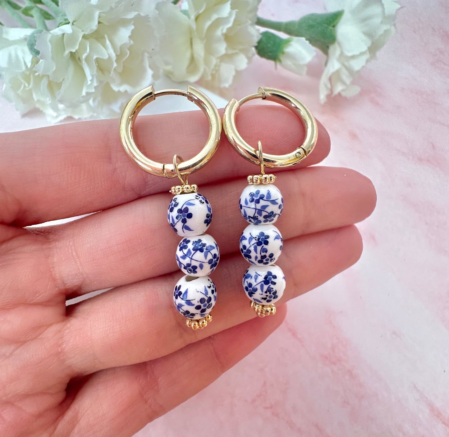 Gold Blue White floral drop bead earrings.