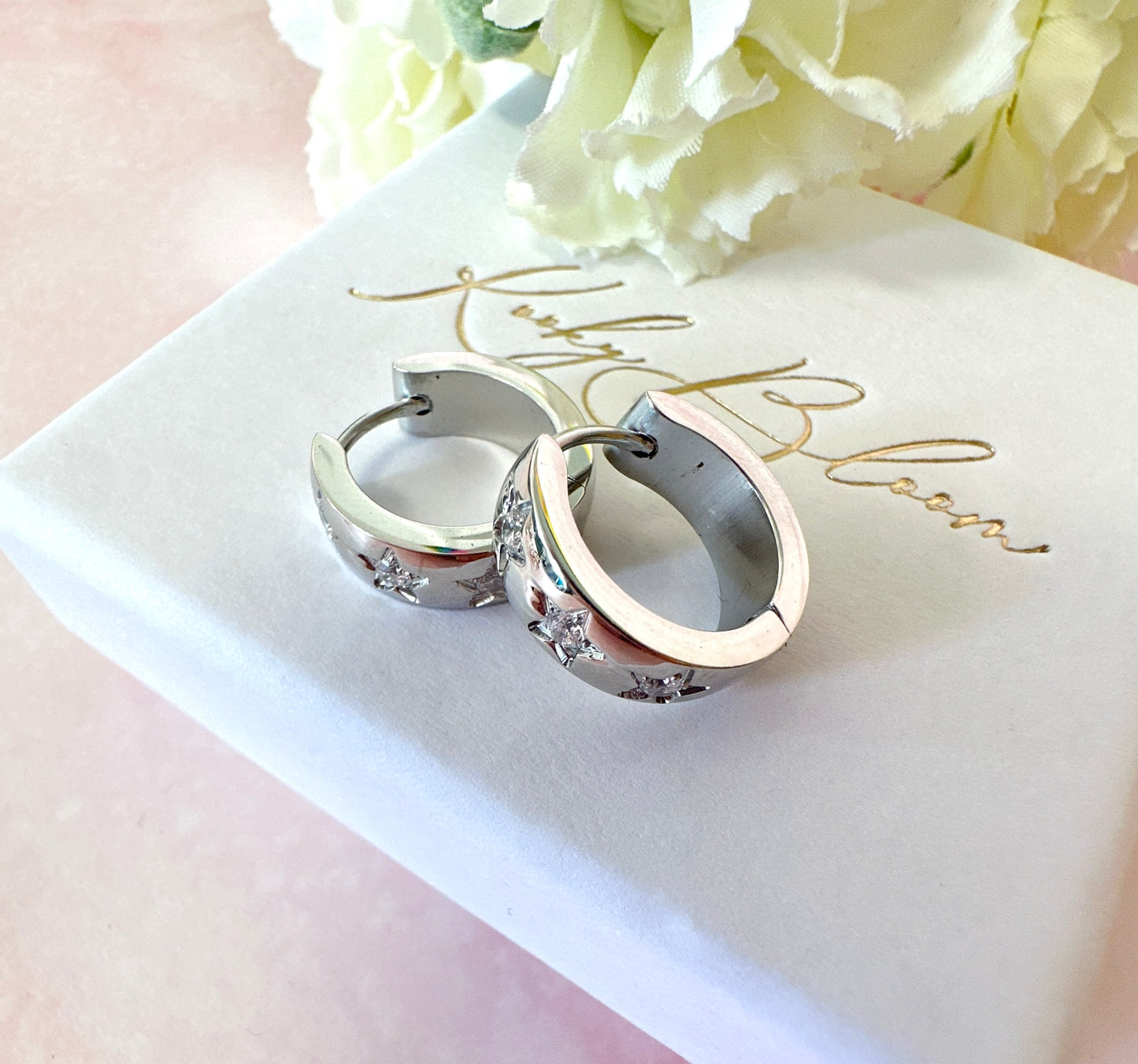 Small Silver Chunky clear CZ star Huggie earrings.
