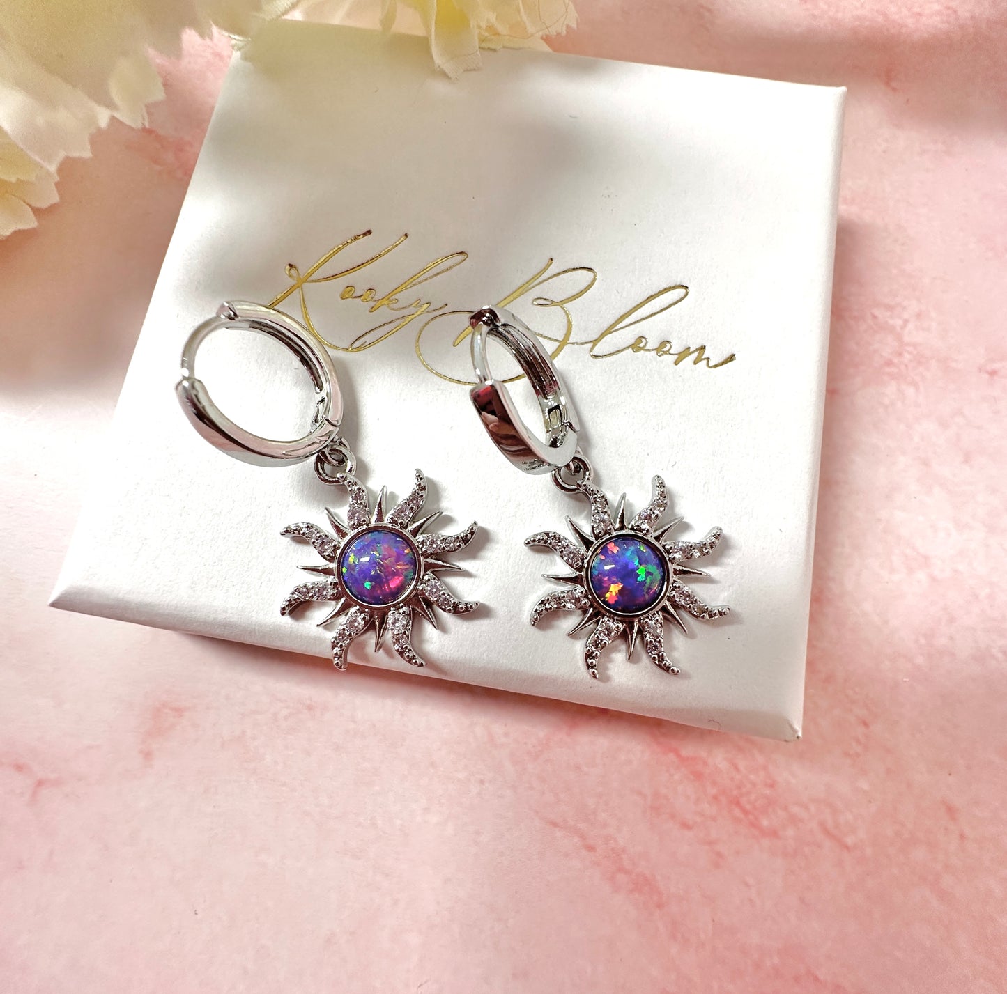 Silver Purple Opal Sun Huggie hoop earrings.