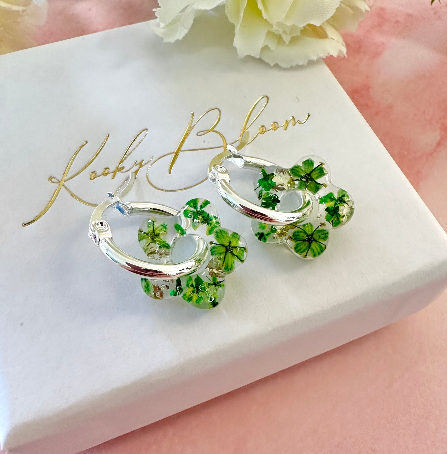 Tiny green bloom flower earrings.