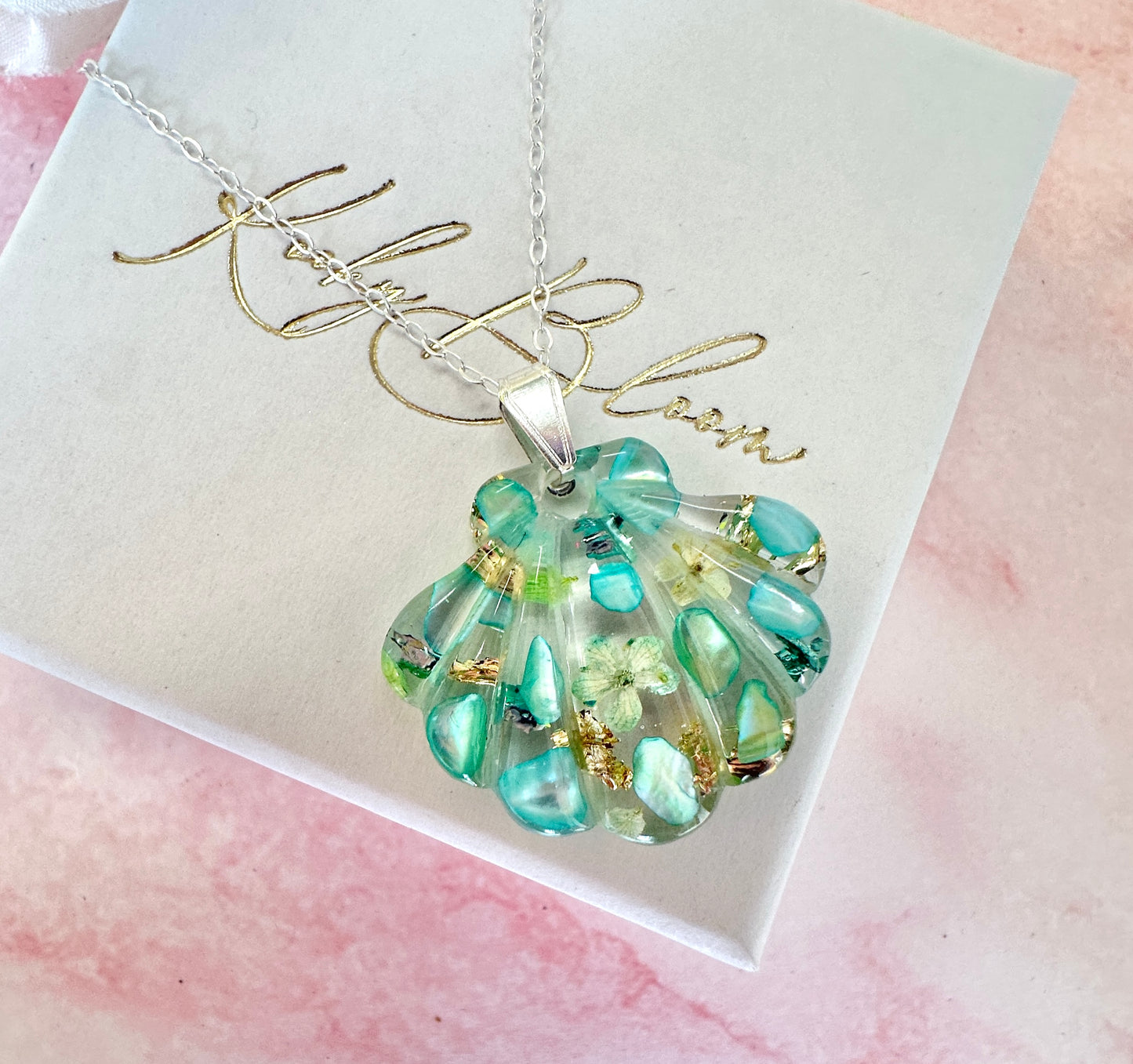 Silver Aqua Seashell Bloom necklace.