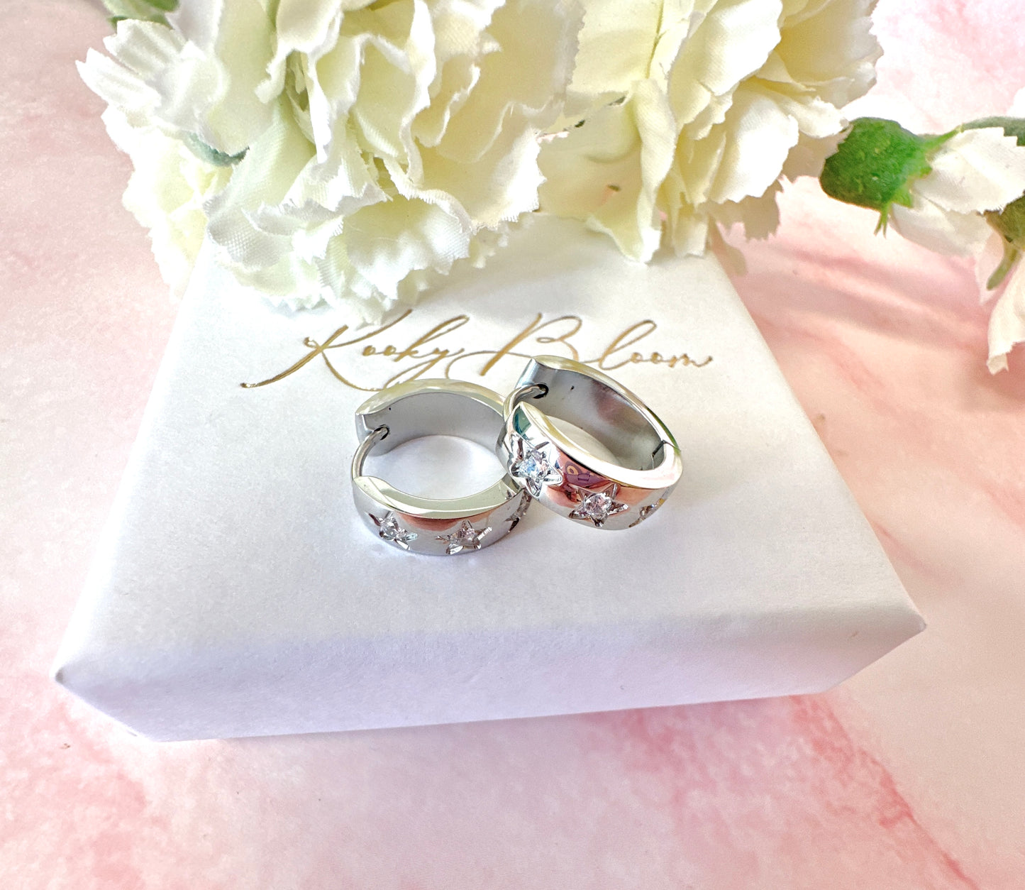Small Silver Chunky clear CZ star Huggie earrings.