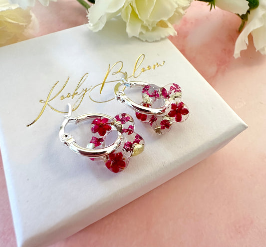Tiny Dark Pink bloom flower earrings.