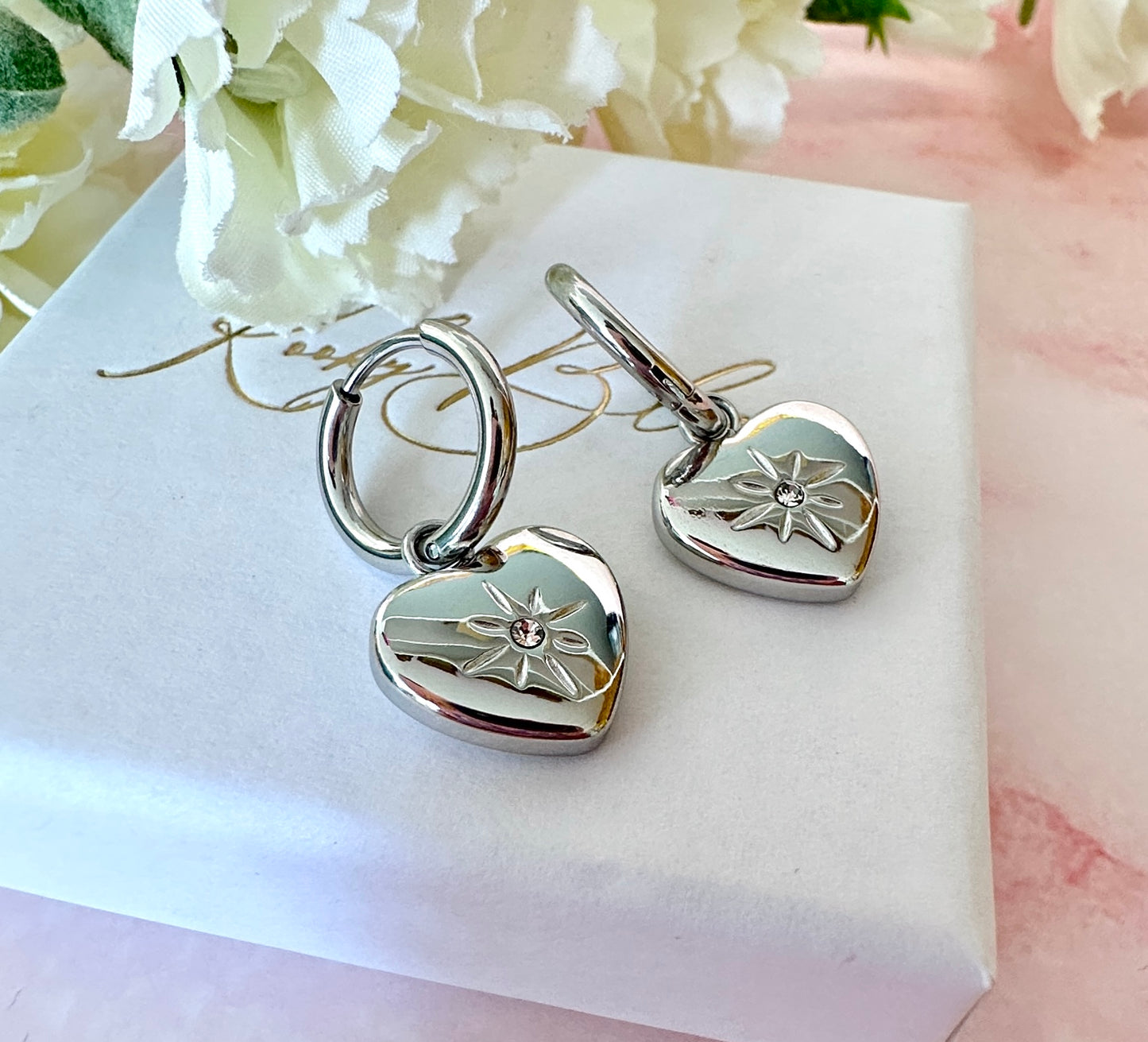 Silver Heart Engraved star Huggie hoop earrings.