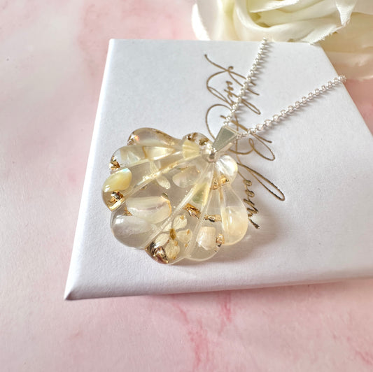 Silver Champagne Seashell Bloom necklace.