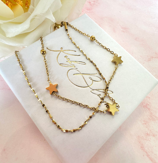 Gold Star layered bracelet.