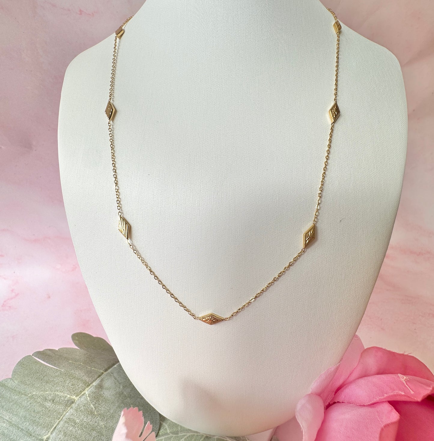 Gold dainty engraved star diamond necklace.