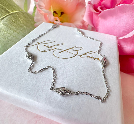 Silver dainty engraved star diamond necklace.