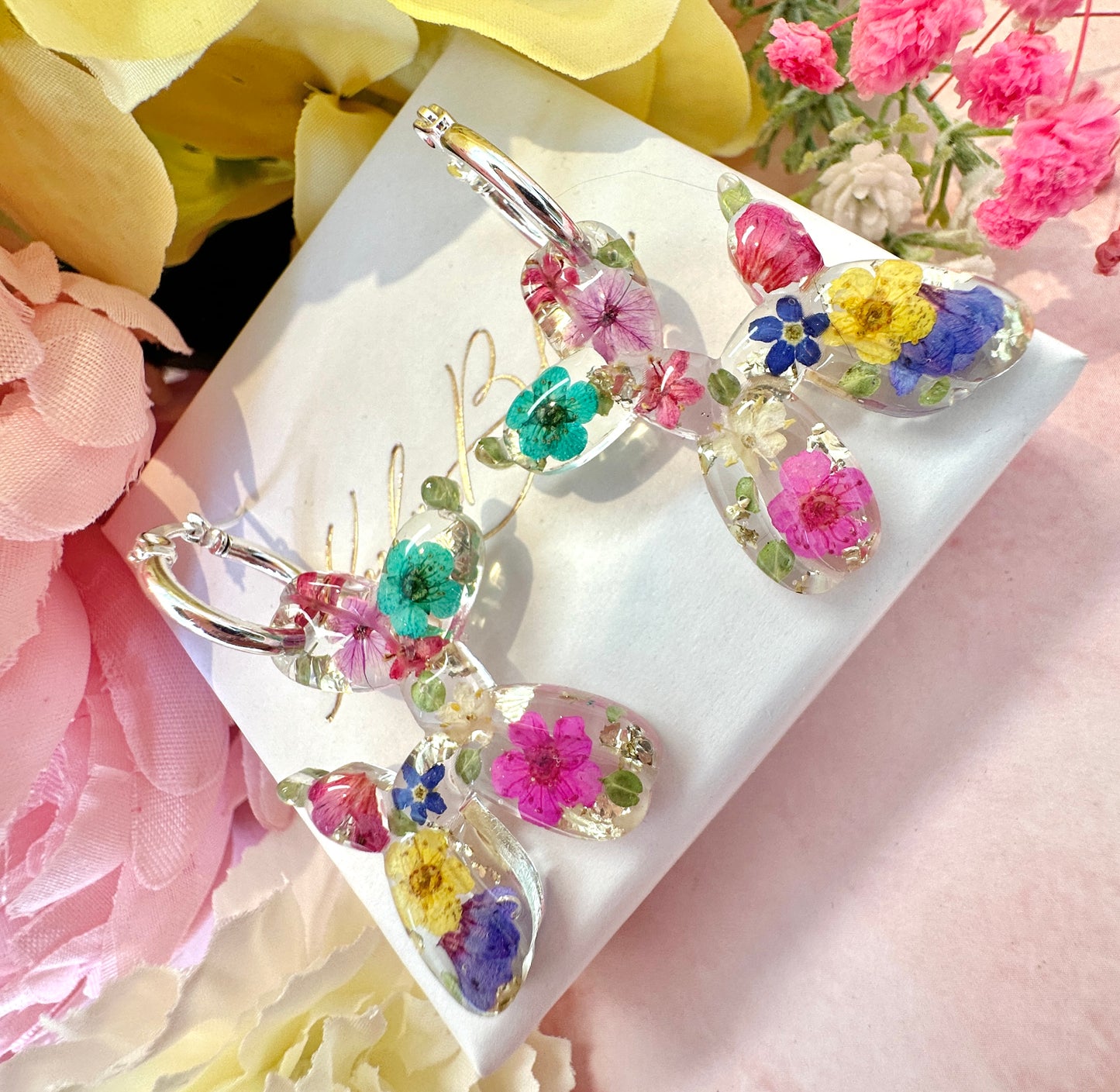 Balloon Dog bloom hoop earrings.