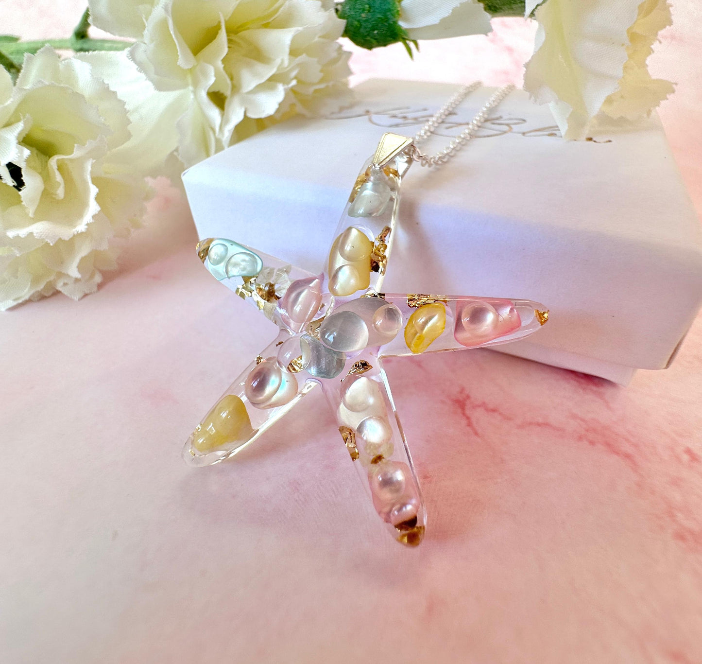 Silver Starfish seashell necklace.