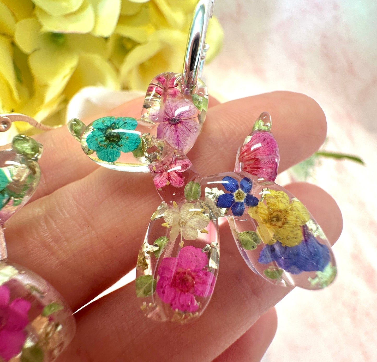 Balloon Dog bloom hoop earrings.