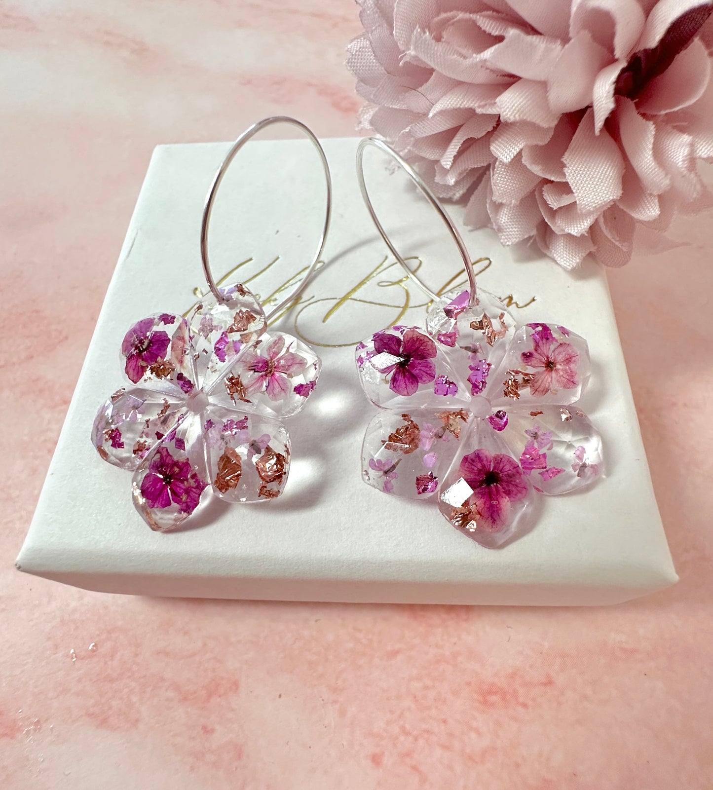 Plumb Blossom diamond cut flower earrings.