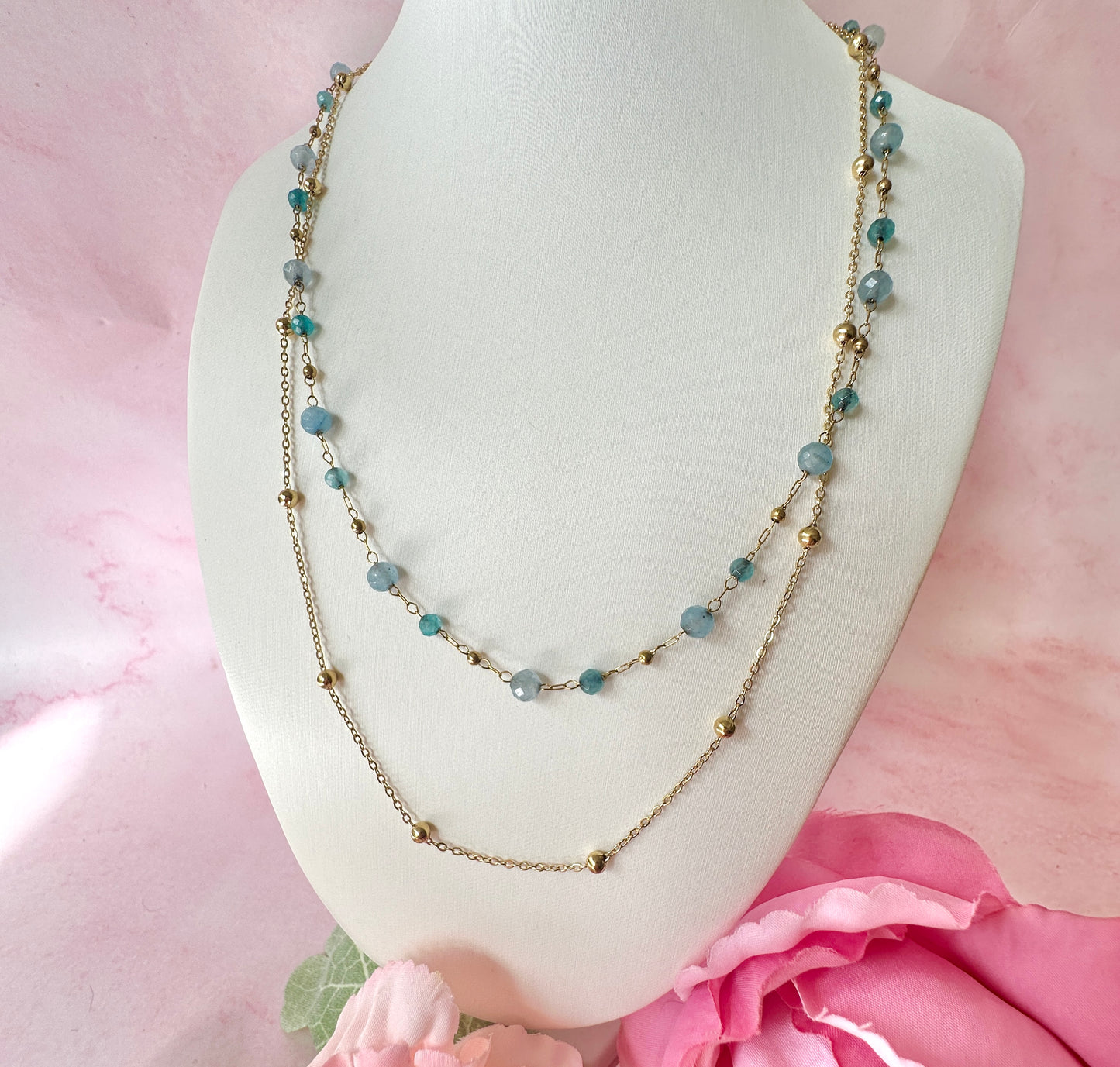 Gold layered blue bead necklace.