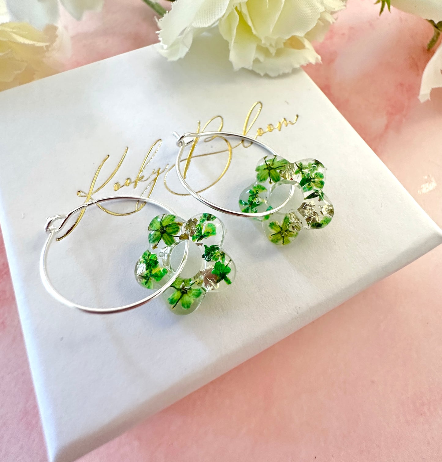 Tiny green bloom flower earrings.