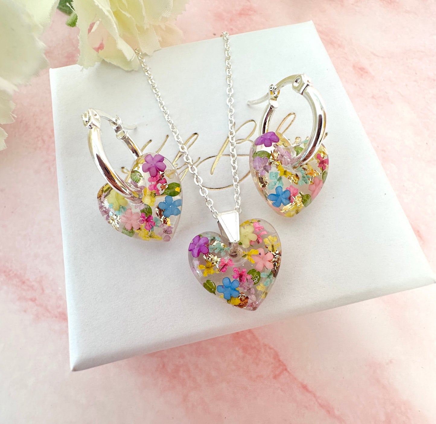 Silver Rainbow Burst bloom Heart necklace.
