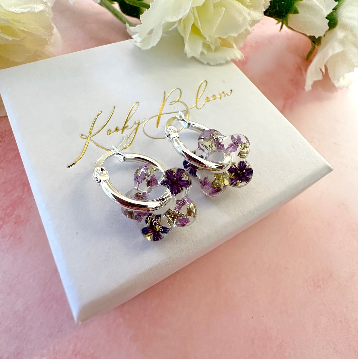 Tiny Purple bloom flower earrings.