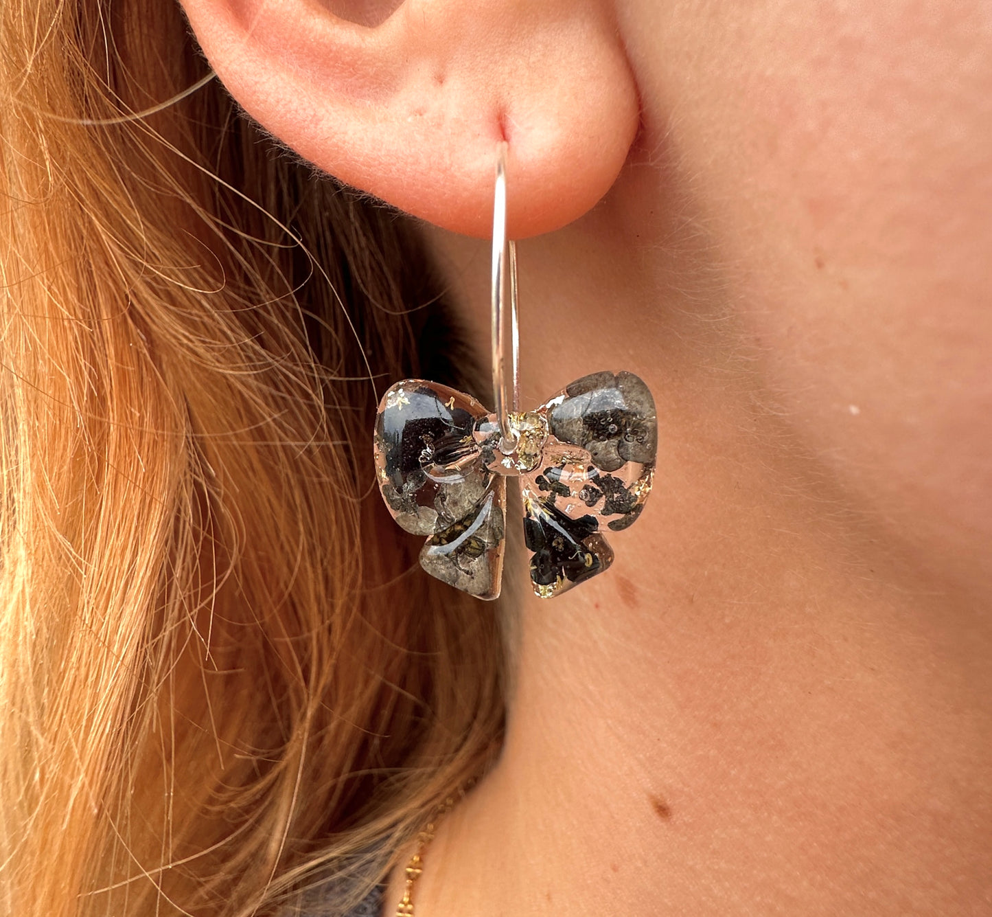 Black ebony Bloom Bow hoop Earrings.