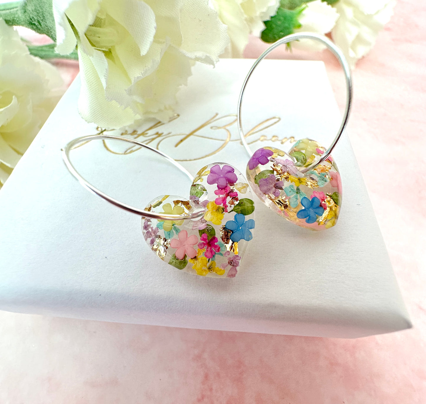 Rainbow Burst bloom heart hoop earrings.