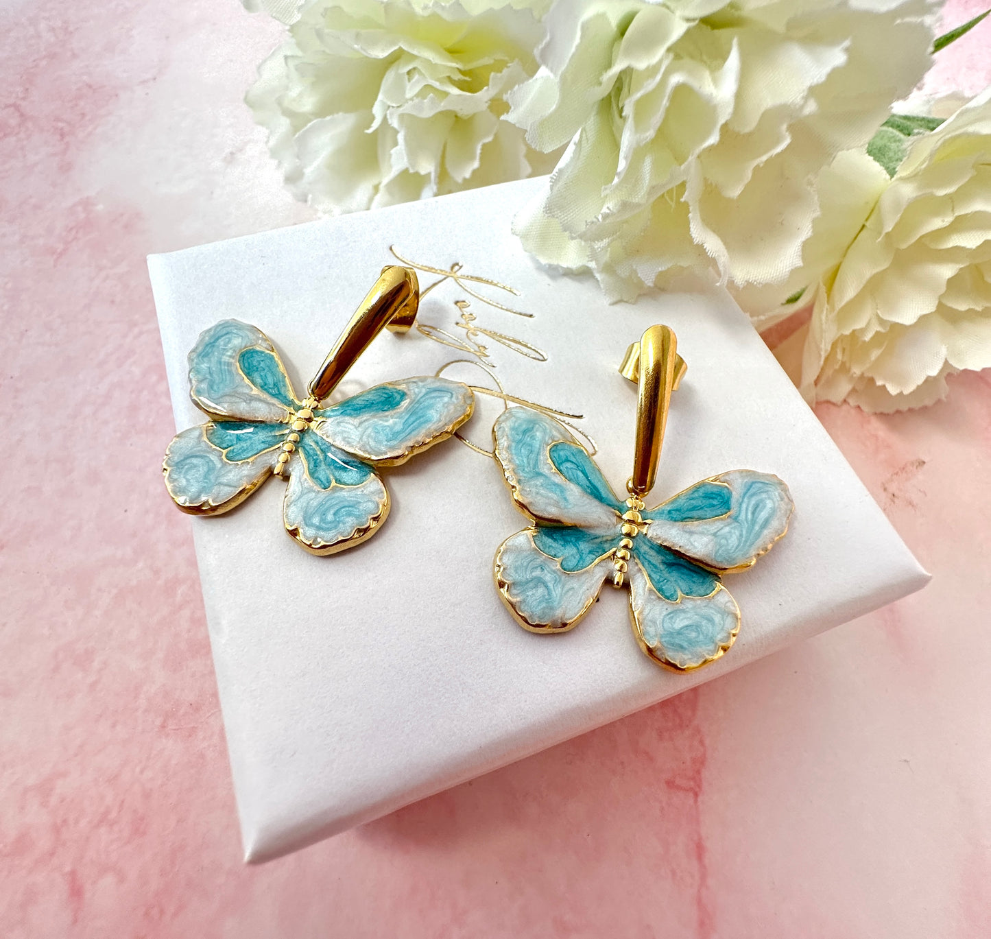 Gold Blue butterfly drop stud earrings .