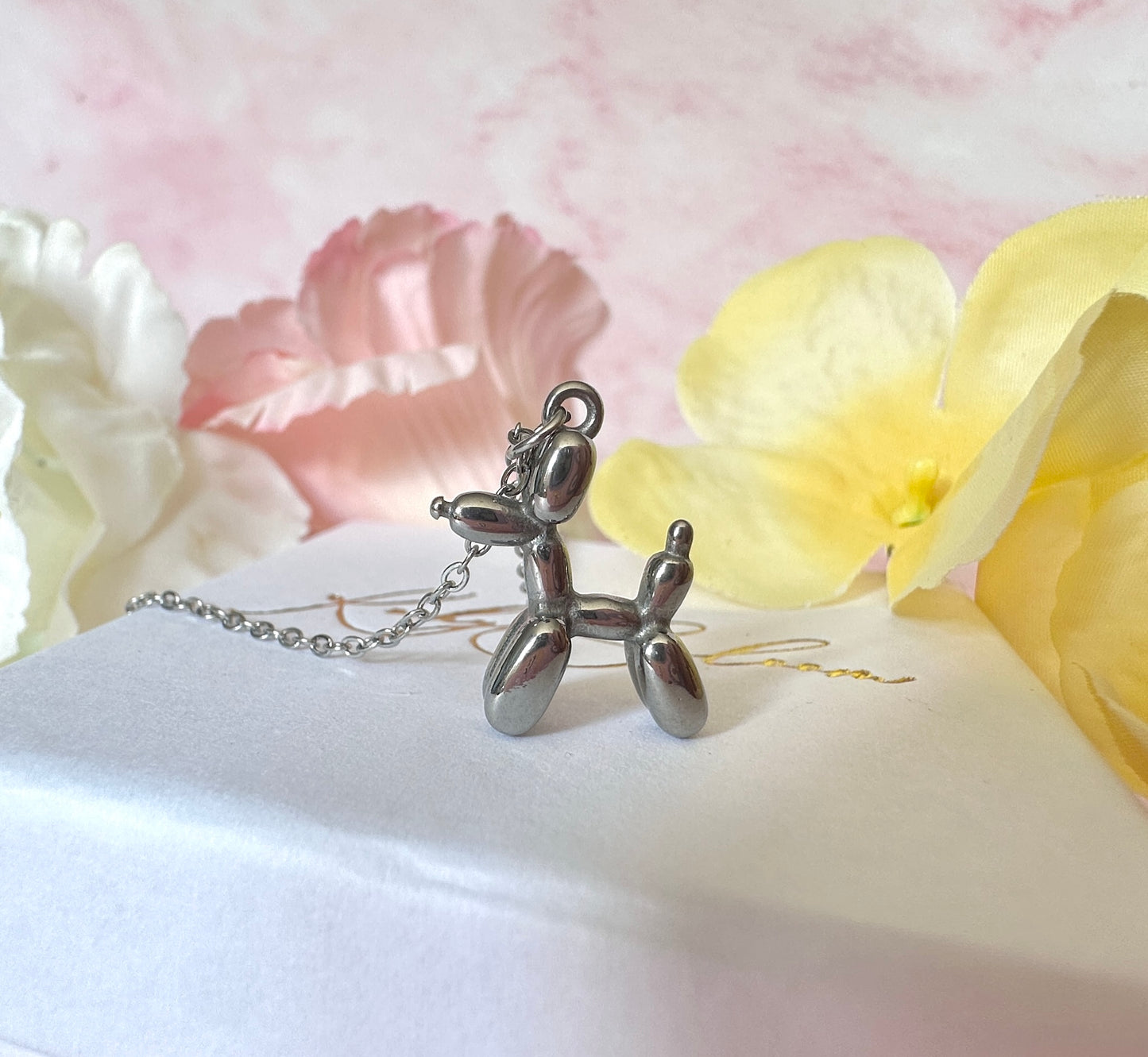 Silver Balloon dog necklace.