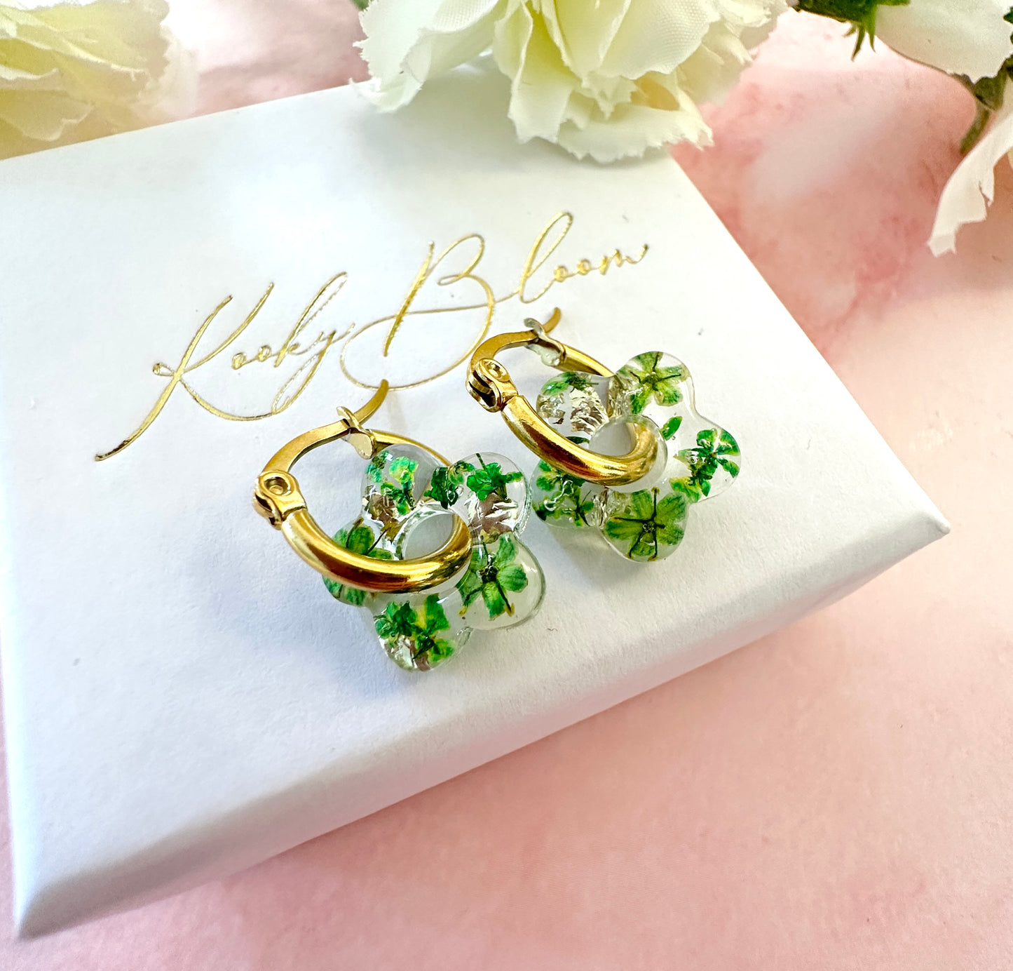 Tiny green bloom flower earrings.