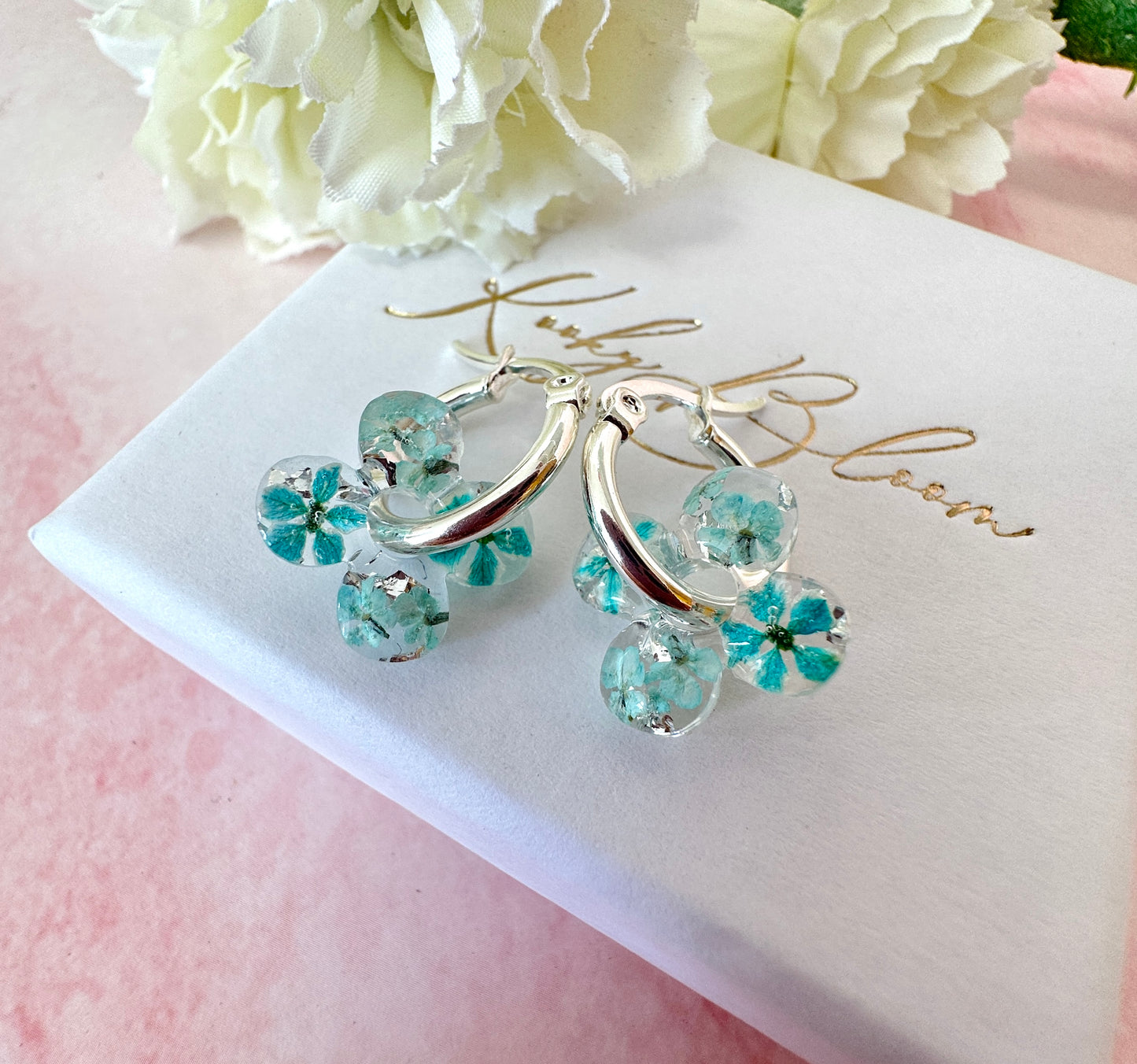 Tiny ice Blue Bloom flower Clover hoop earrings.