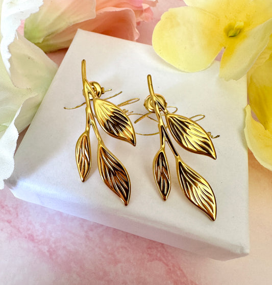 Gold vine leaf oversized stud earrings.