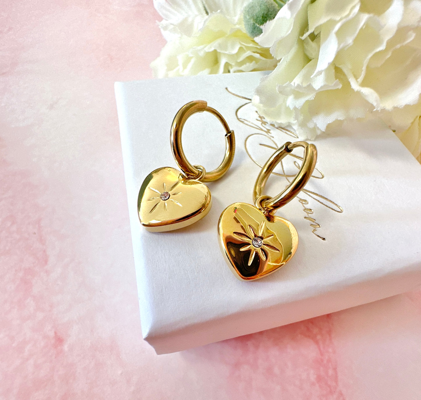 Gold Heart Engraved star Huggie hoop earrings.
