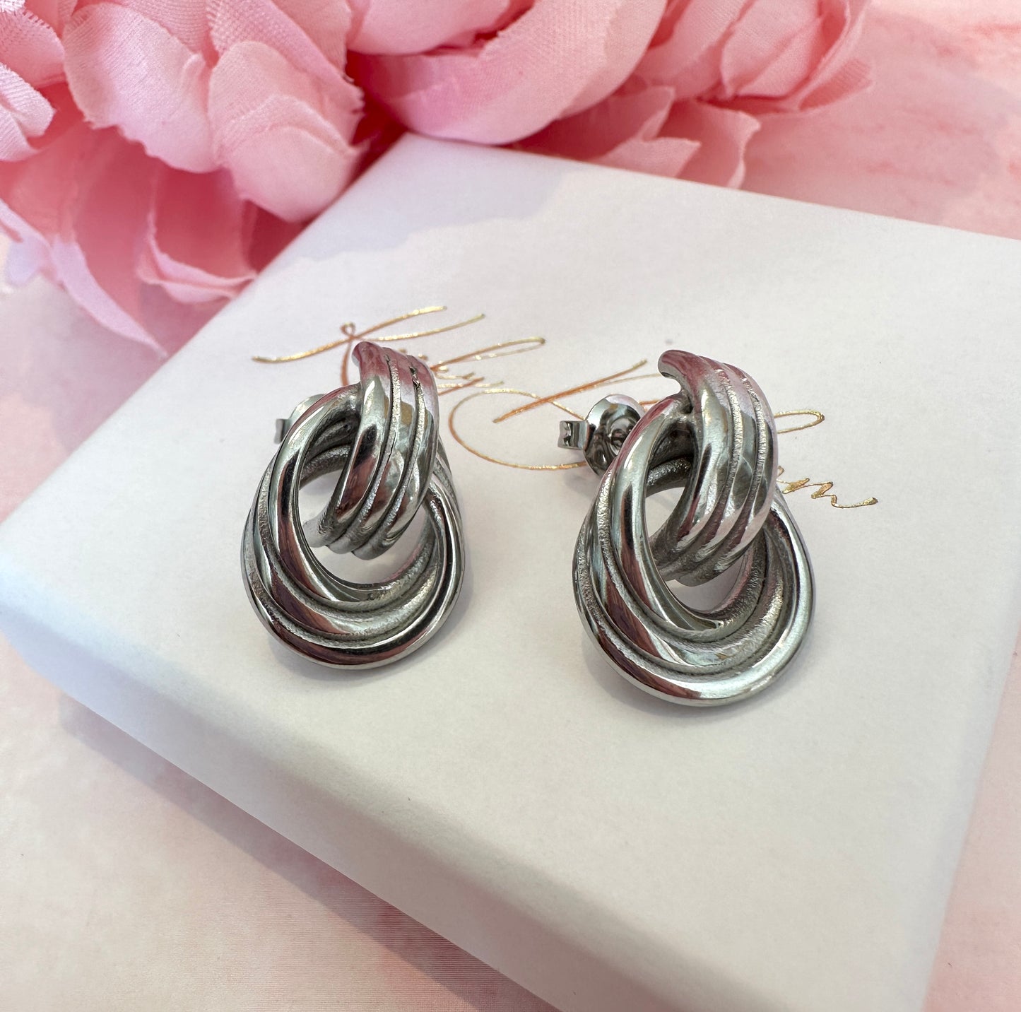 Silver Loop chunky stud earrings.