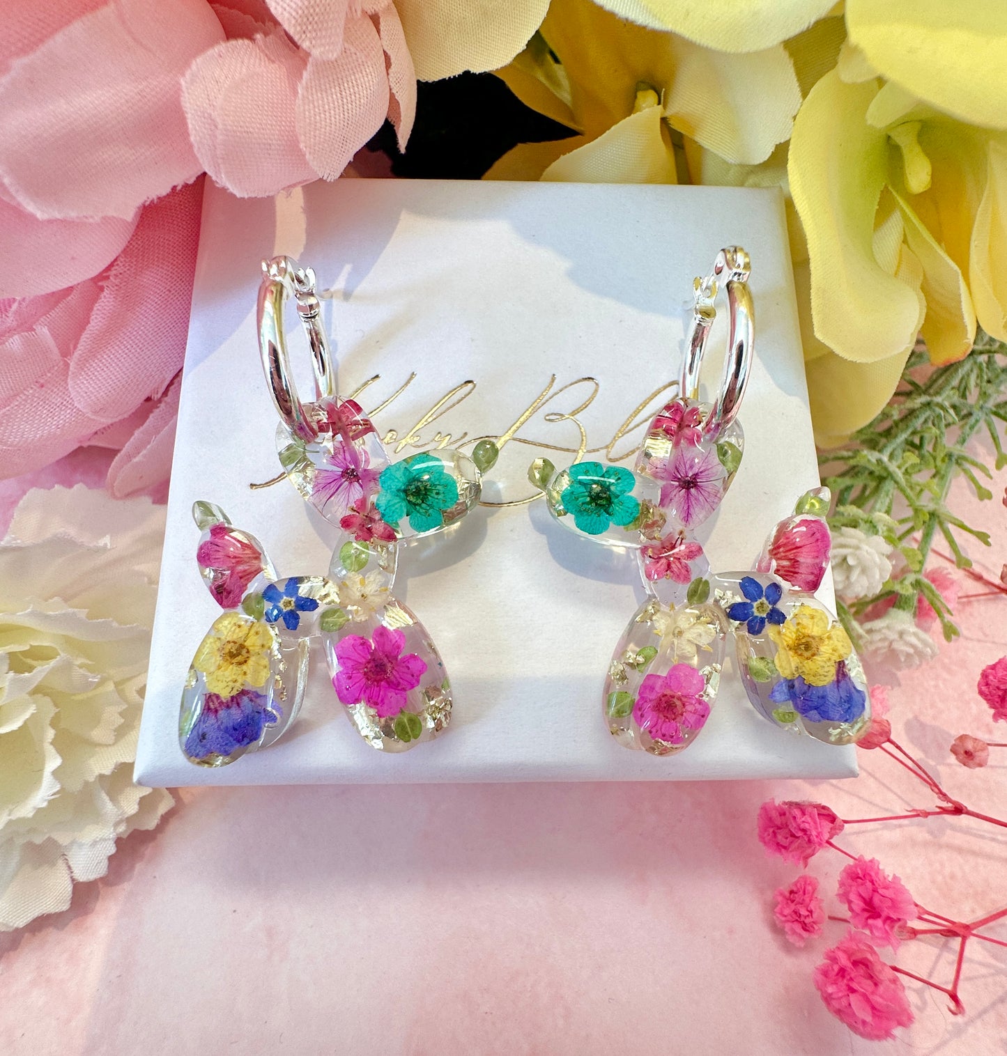 Balloon Dog bloom hoop earrings.