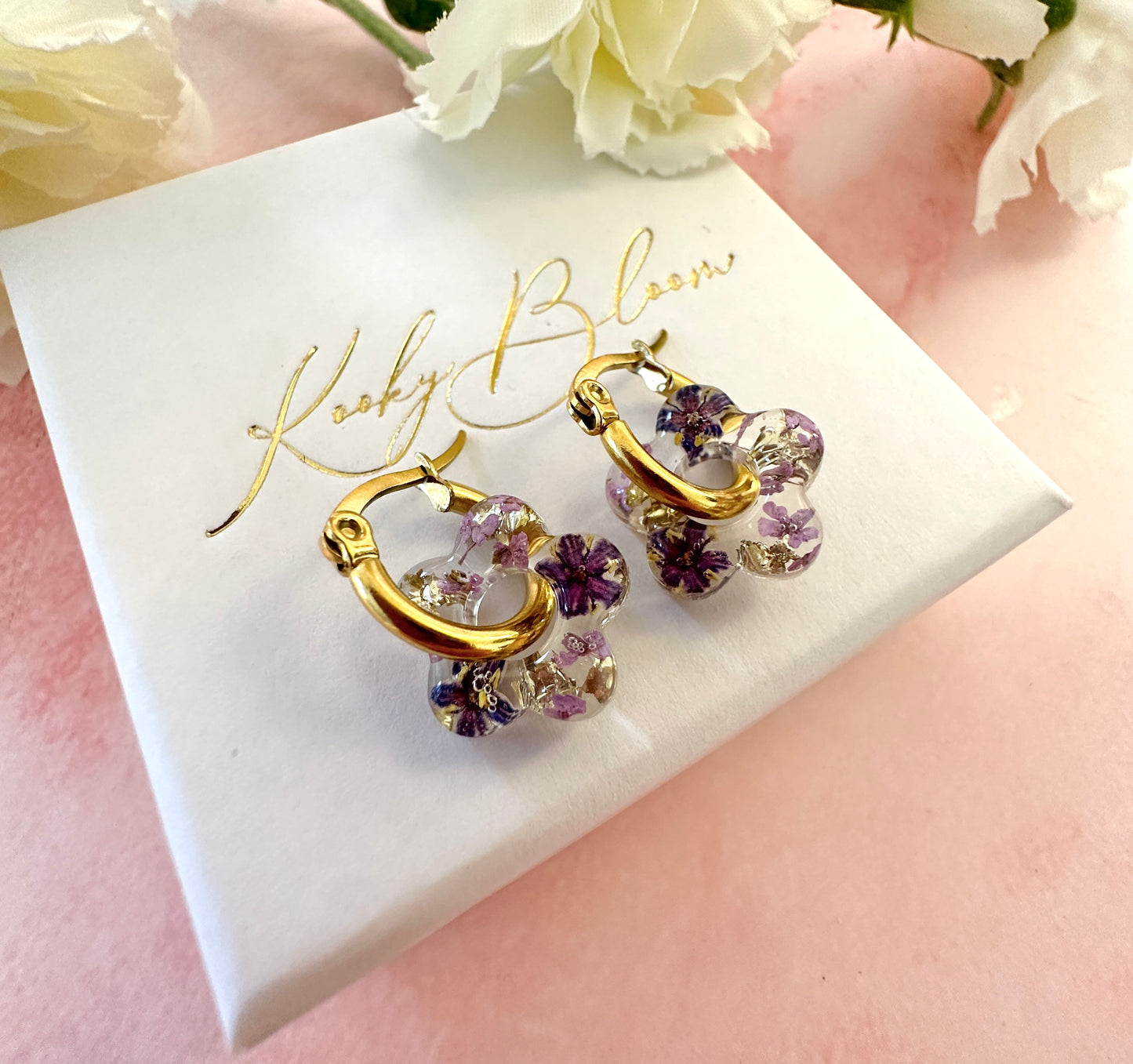 Tiny Purple bloom flower earrings.