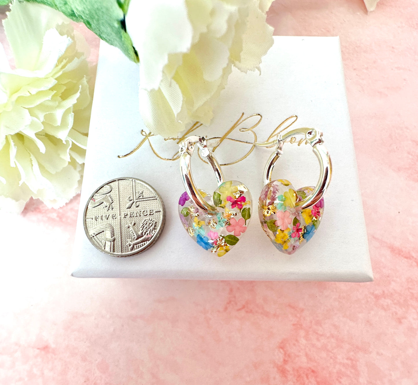 Rainbow Burst bloom heart hoop earrings.