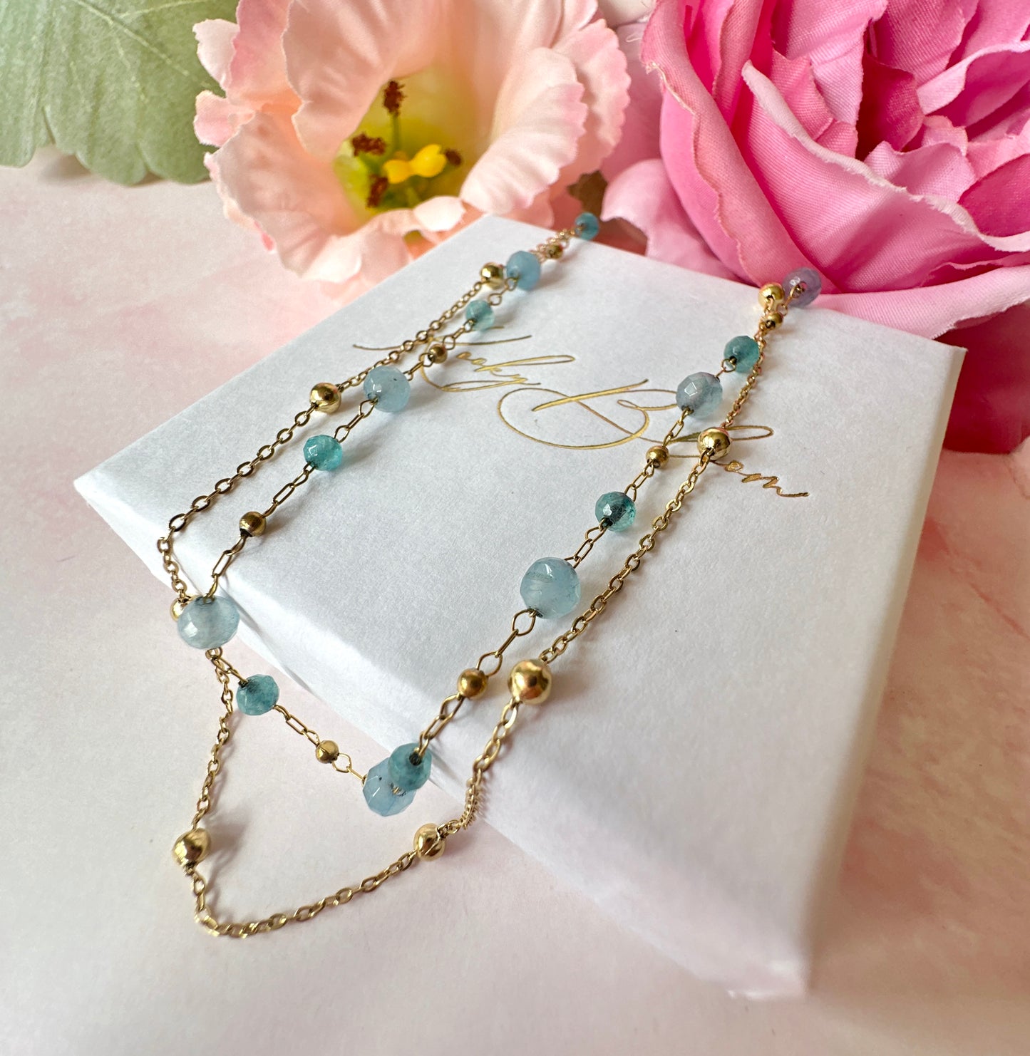 Gold layered blue bead necklace.