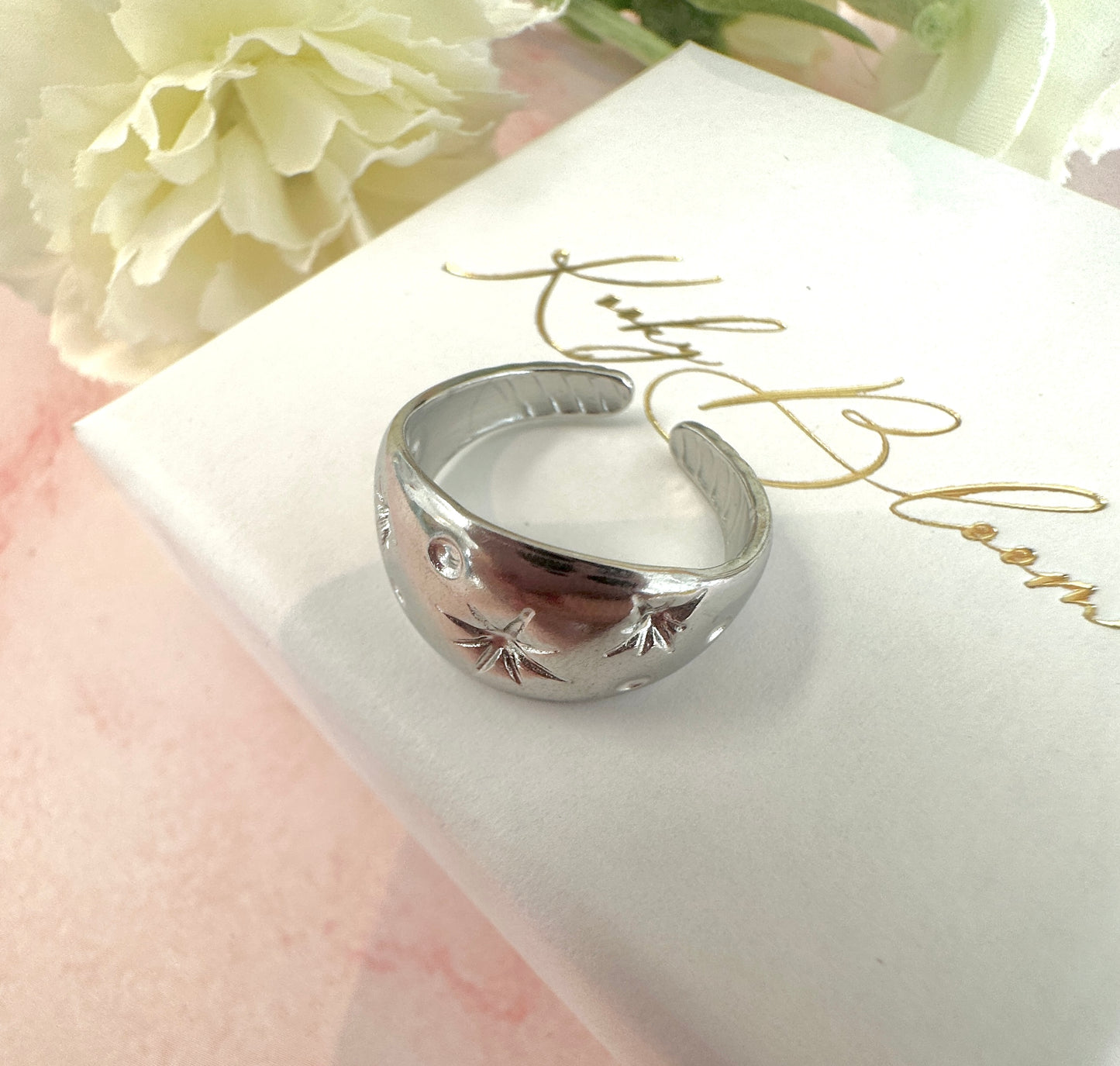 Silver domed celestial ring.