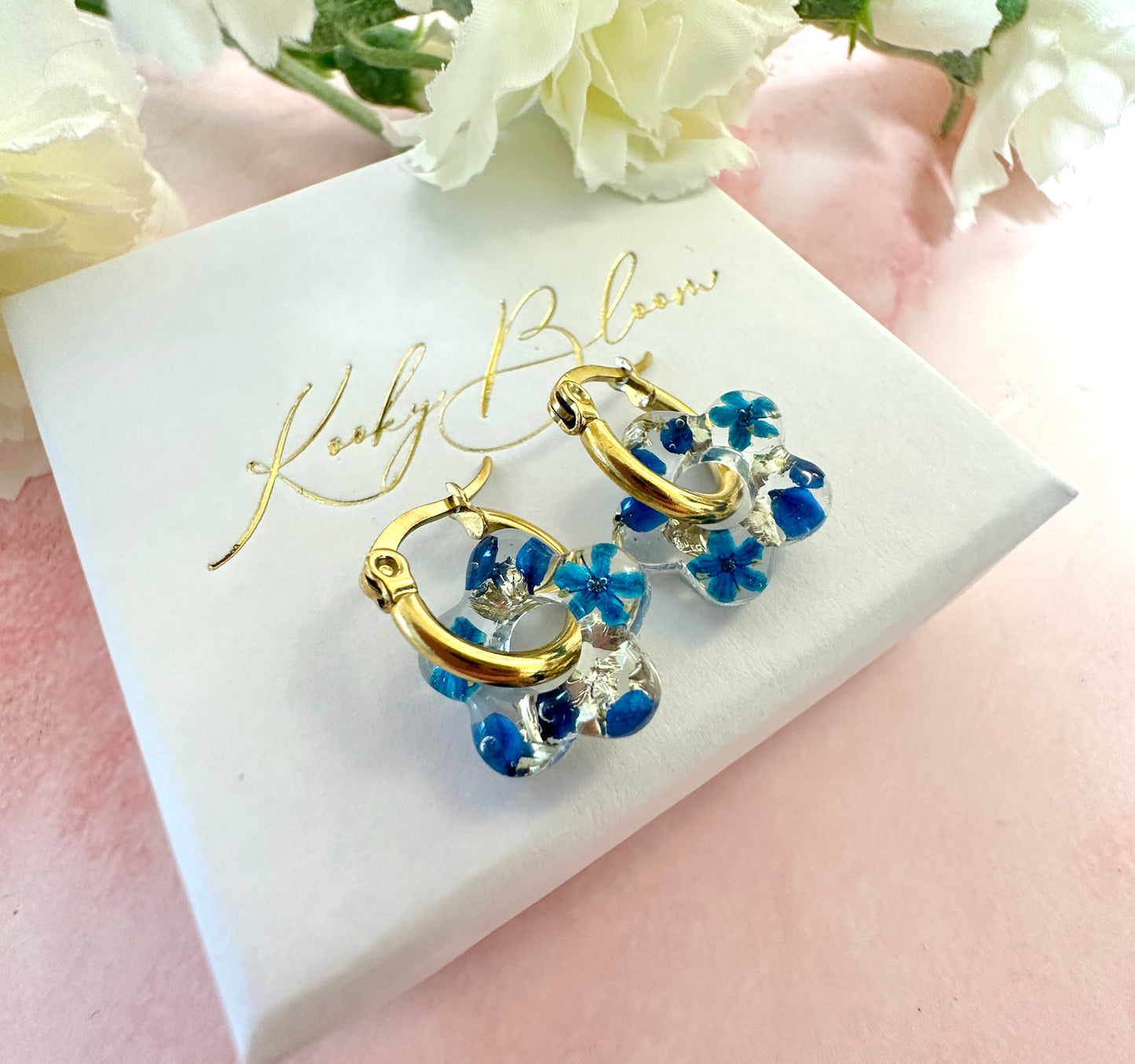 Tiny Blue bloom flower earrings.