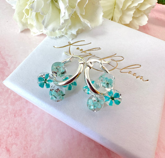 Tiny ice Blue Bloom flower Clover hoop earrings.
