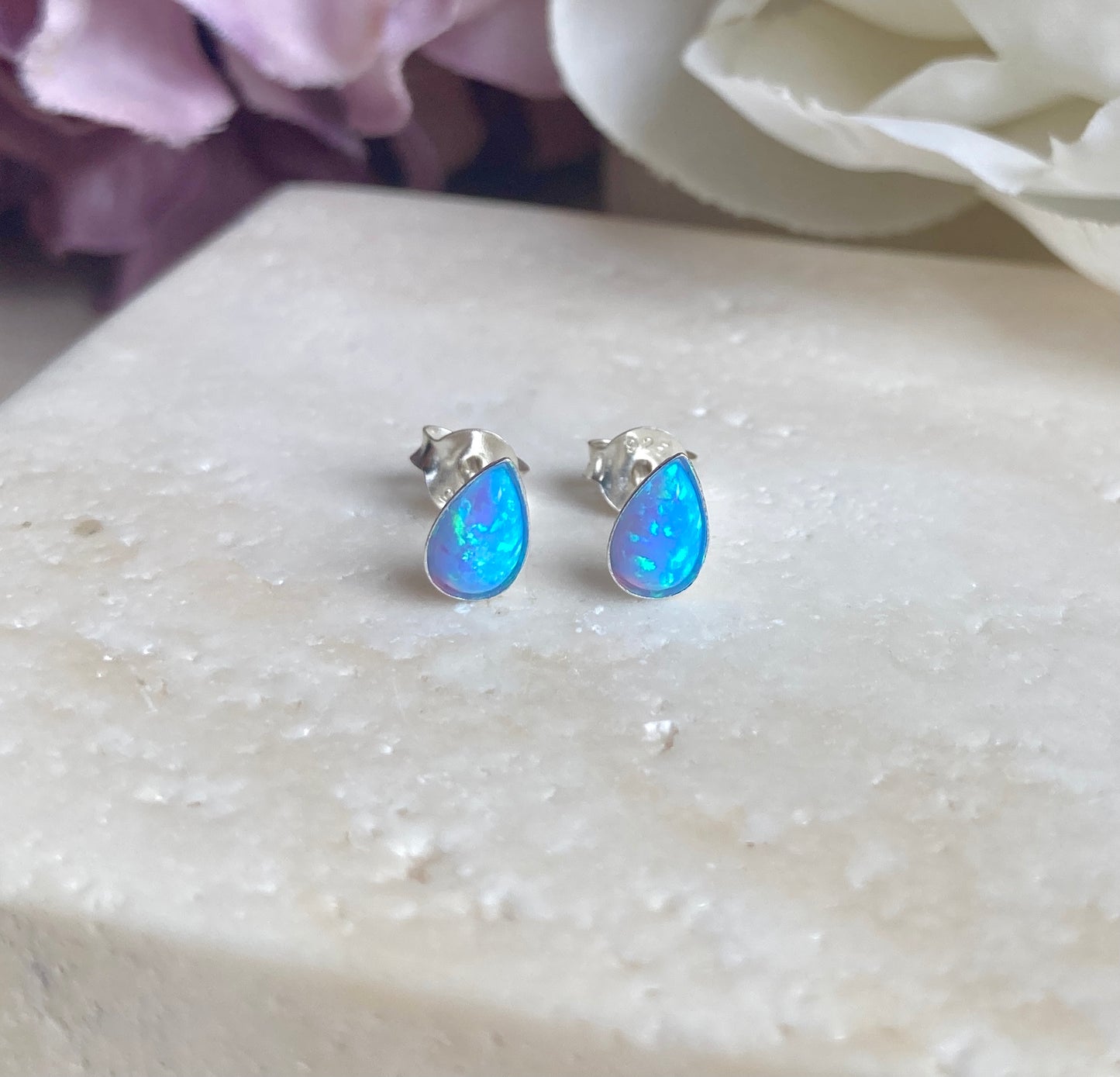 925 sterling silver Blue Opal teardrop stud earrings.