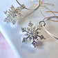 Silver CZ snowflake 925 Sterling hoop earrings.