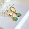Gold tiny Blue daisy huggie earrings.
