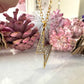 Gold CZ Lightning Bolt necklace.