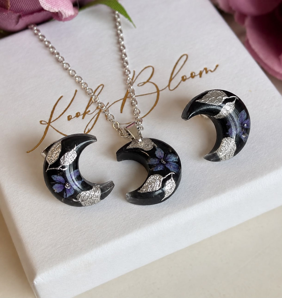 Mystical Dark Bloom Moon stud earrings.