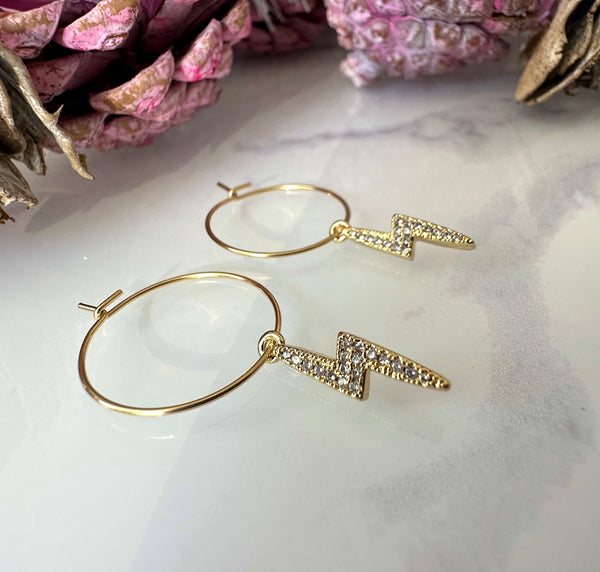 Gold CZ Lightning Bolt Hoop earrings.