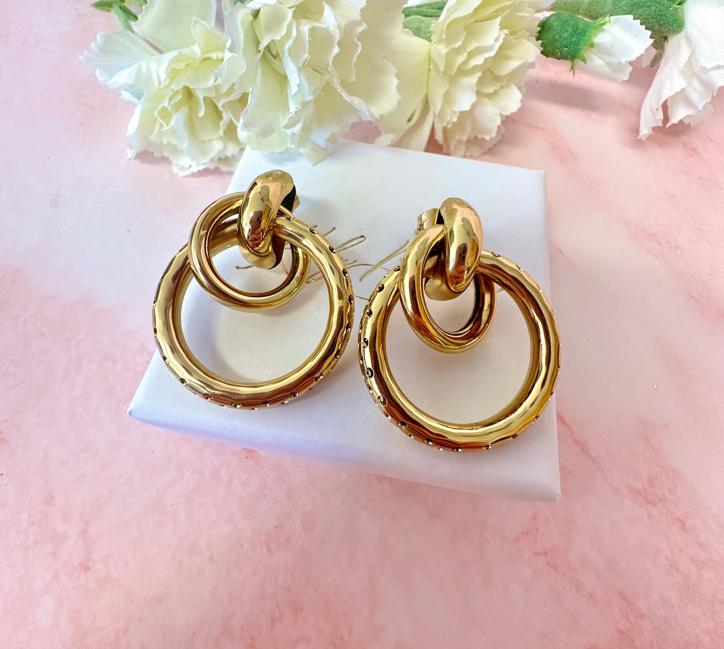 Gold oversized Double ring stud earrings.