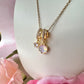 Gold opalescent cz charm cluster Necklace.