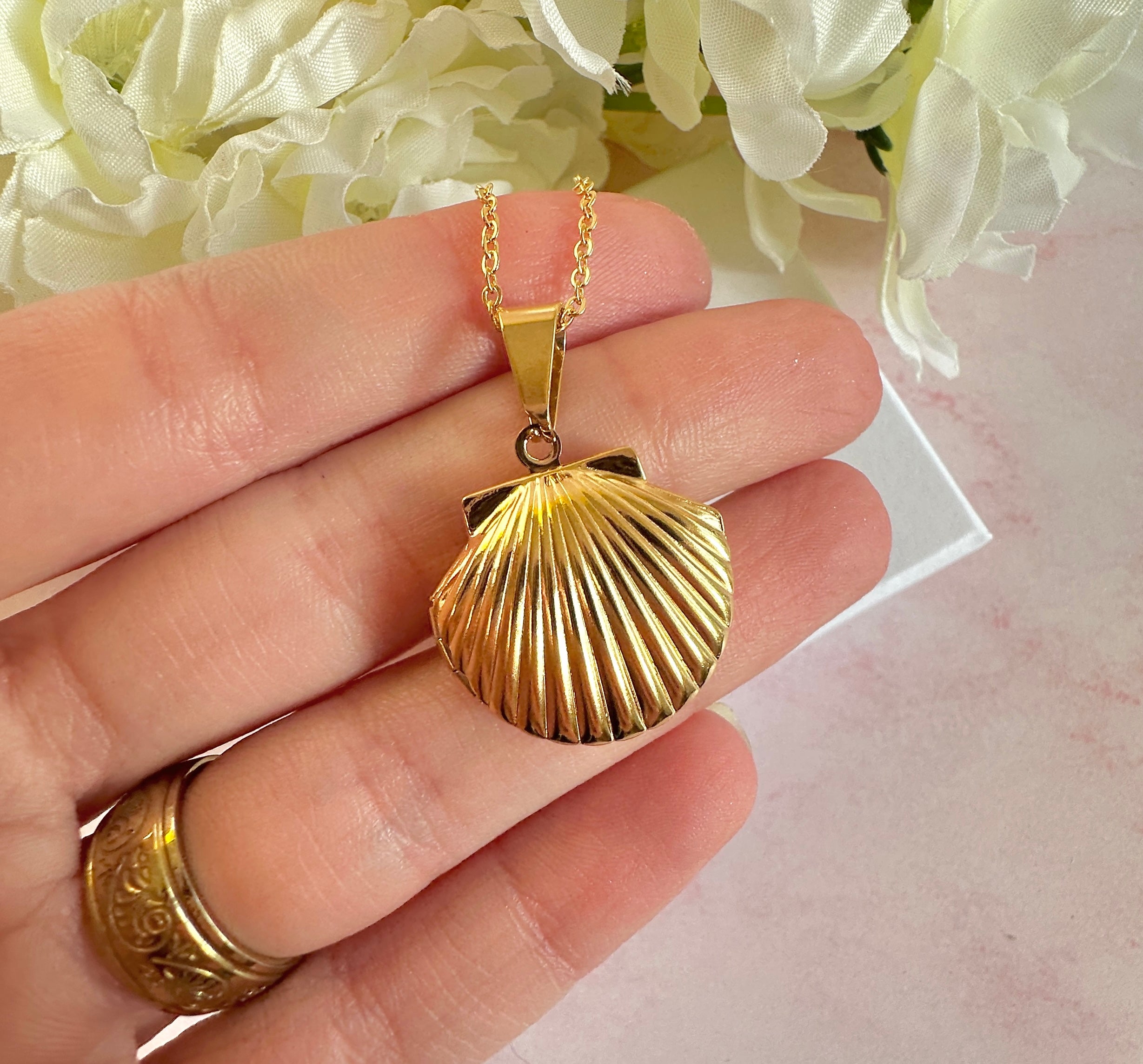 Gold Seashell Locket necklace.
