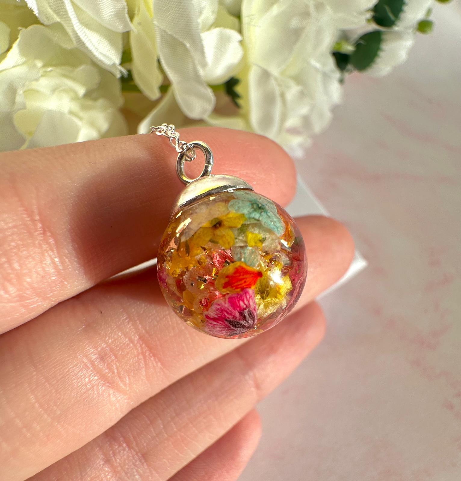 Silver Flower confetti Globe necklace.