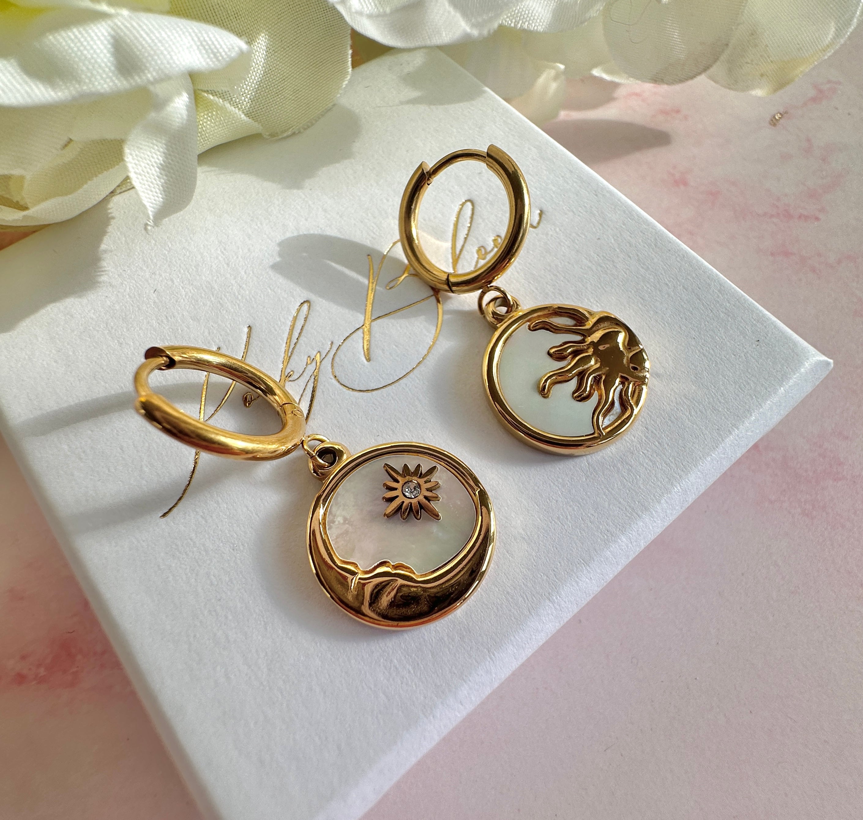 Gold Sun & Moon shell Huggie hoop earrings.