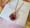 Gold chocolate teardrop necklace.